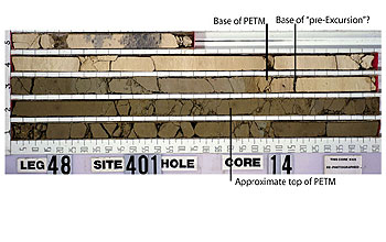 Ocean sediment core sample depicting, among other things, the base and top of the PETM period. Note the color change from lighter colored to darker colored during this time (Source: NSF, Scripps Institution of Oceanography).