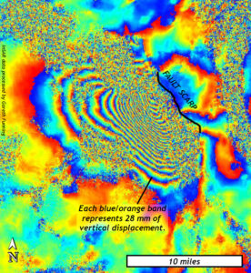Map of an area of Turkey showing vertical displacements from the 1995 Dinar earthquake as measured by InSAR. Big blotches of concentrically repeating color bands emanate from a well-defined fault scarp. Each color band represents 28 mm of vertical displacement. There are at least 25 such bands on the southwest side of the fault. Field of view measures about 20 by 20 miles. Data processed by Gareth Funning.